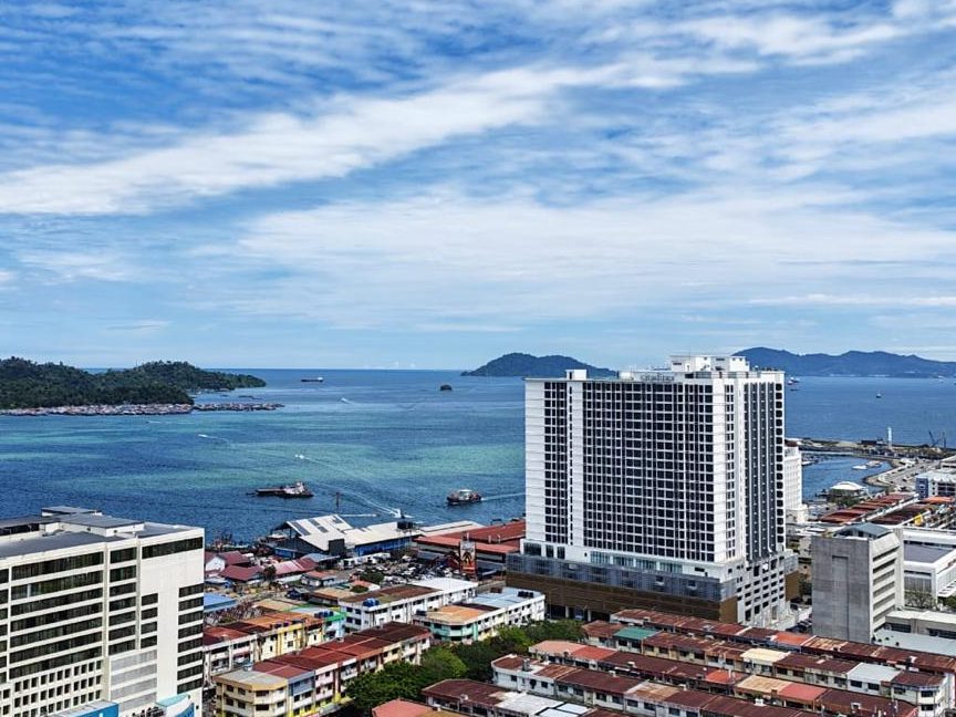 Kota Kinabalu's waterfront and city rooftops looking out to the islands of the Tunku Abdul Rahman Marine Park
