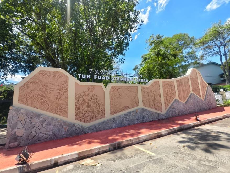 The carved stone entrance wall of Tun Fuad Stephens Botanical Park